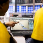 smart factory experts optimizing assembly line and conveyor belts